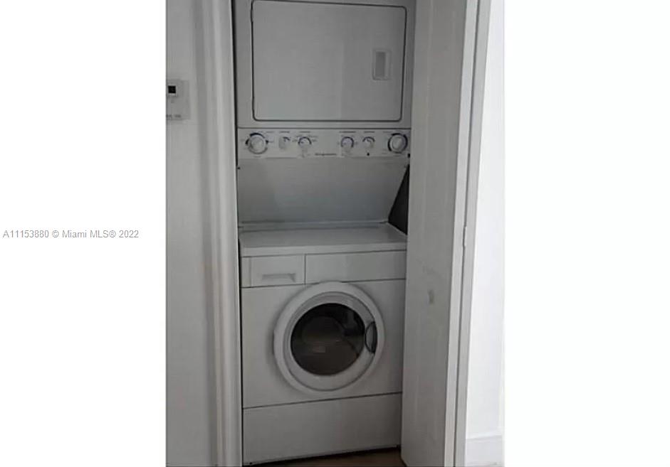 120 South Douglas Road, Unit 306 Miami, FL 33134 - Photo 17 of 17 a utility room with dryer and washer