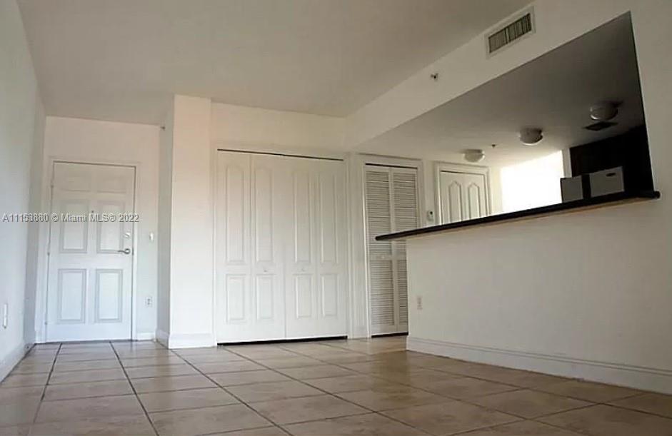 120 South Douglas Road, Unit 306 Miami, FL 33134 - Photo 2 of 17 a view of an empty room
