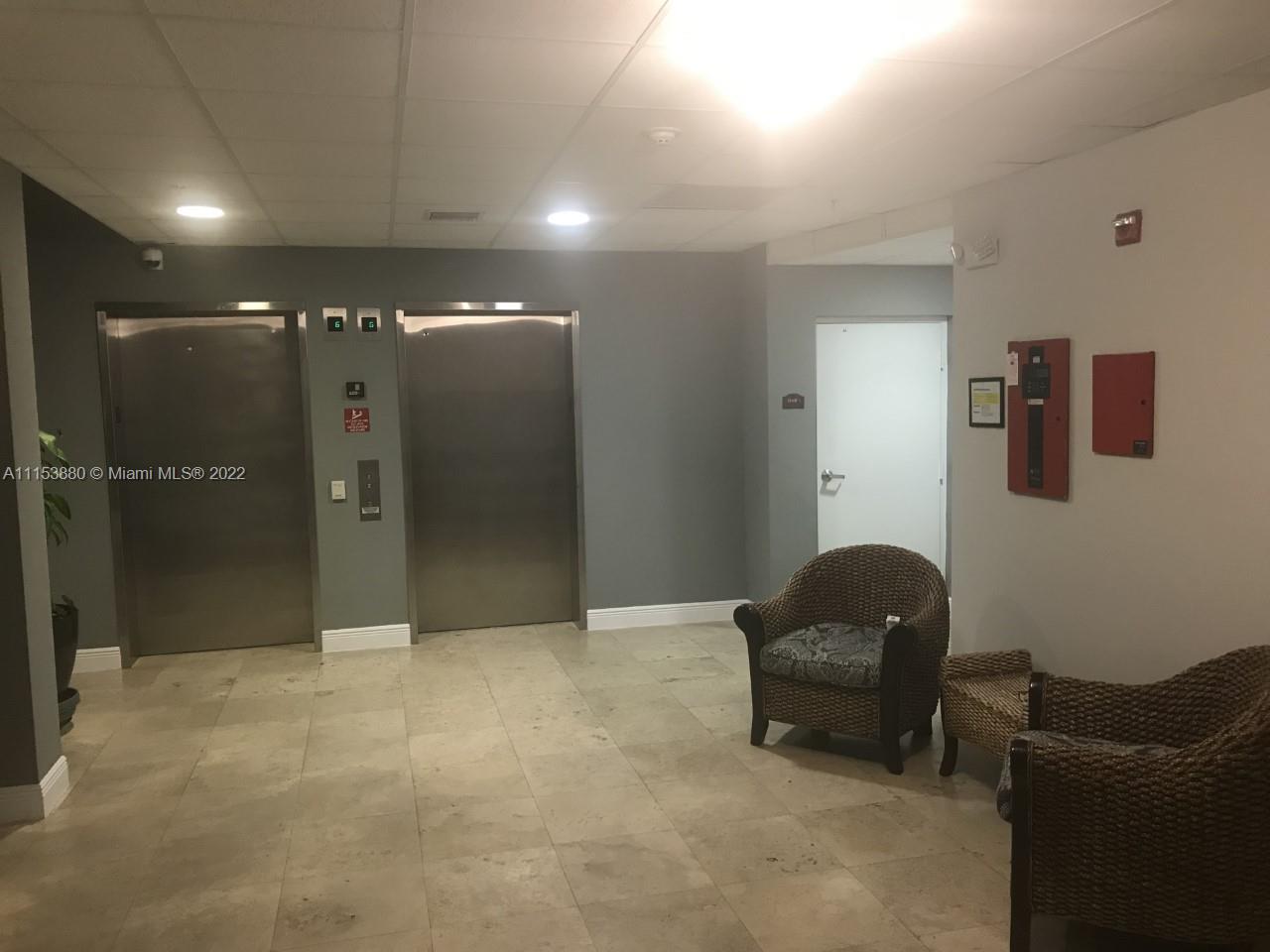 120 South Douglas Road, Unit 306 Miami, FL 33134 - Photo 5 of 17 a room with furniture and a bathroom