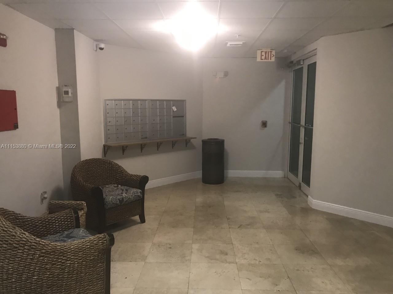 120 South Douglas Road, Unit 306 Miami, FL 33134 - Photo 6 of 17 a living room with furniture and a window