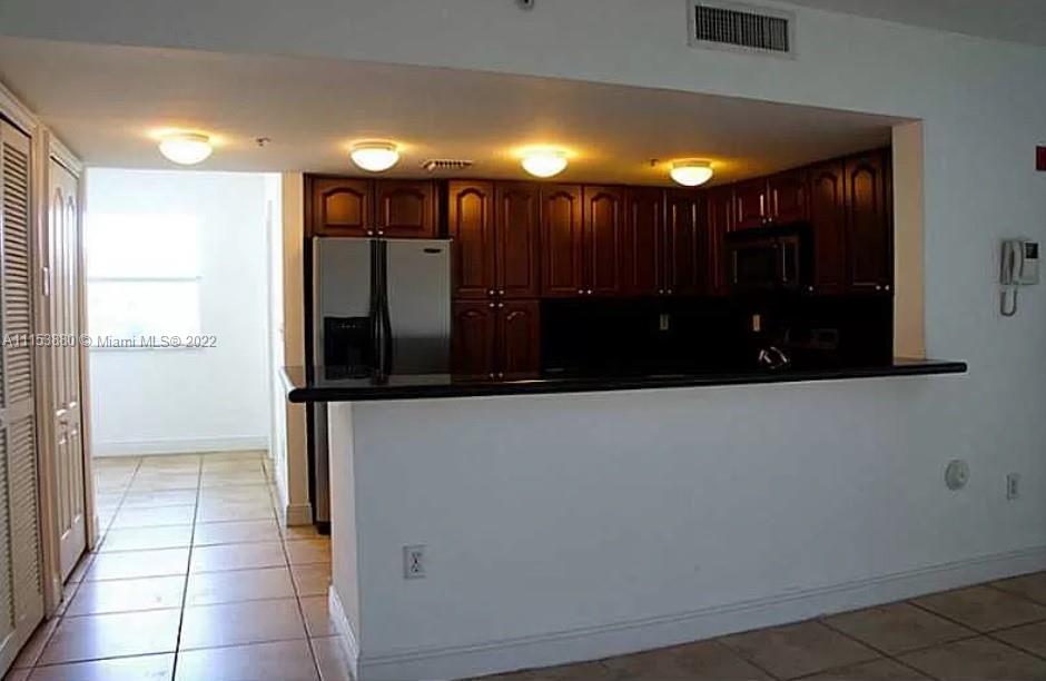 120 South Douglas Road, Unit 306 Miami, FL 33134 - Photo 9 of 17 a view of gallery with a large window