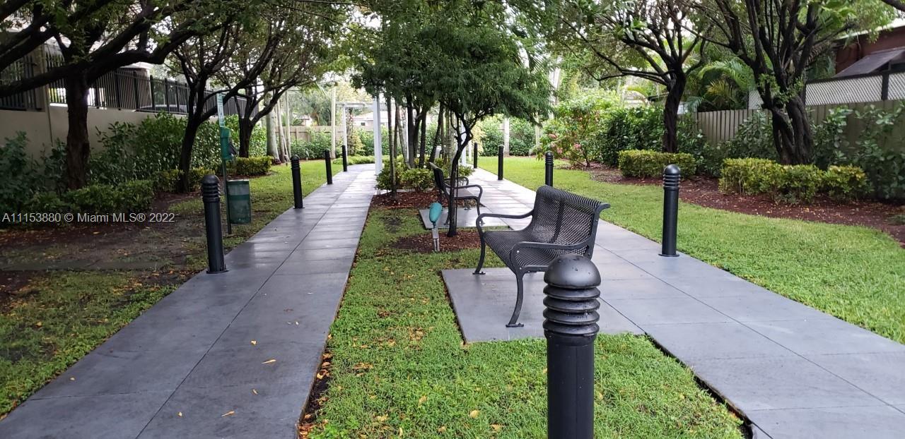 120 South Douglas Road, Unit 306 Miami, FL 33134 - Photo 10 of 17 a view of a garden with plants and trees