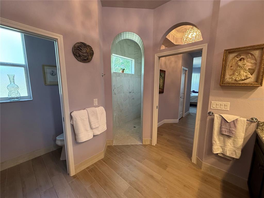 13110 Bamboo Street Spring Hill, FL 34609 - Photo 25 of 56 a view of a hallway with wooden floor and door