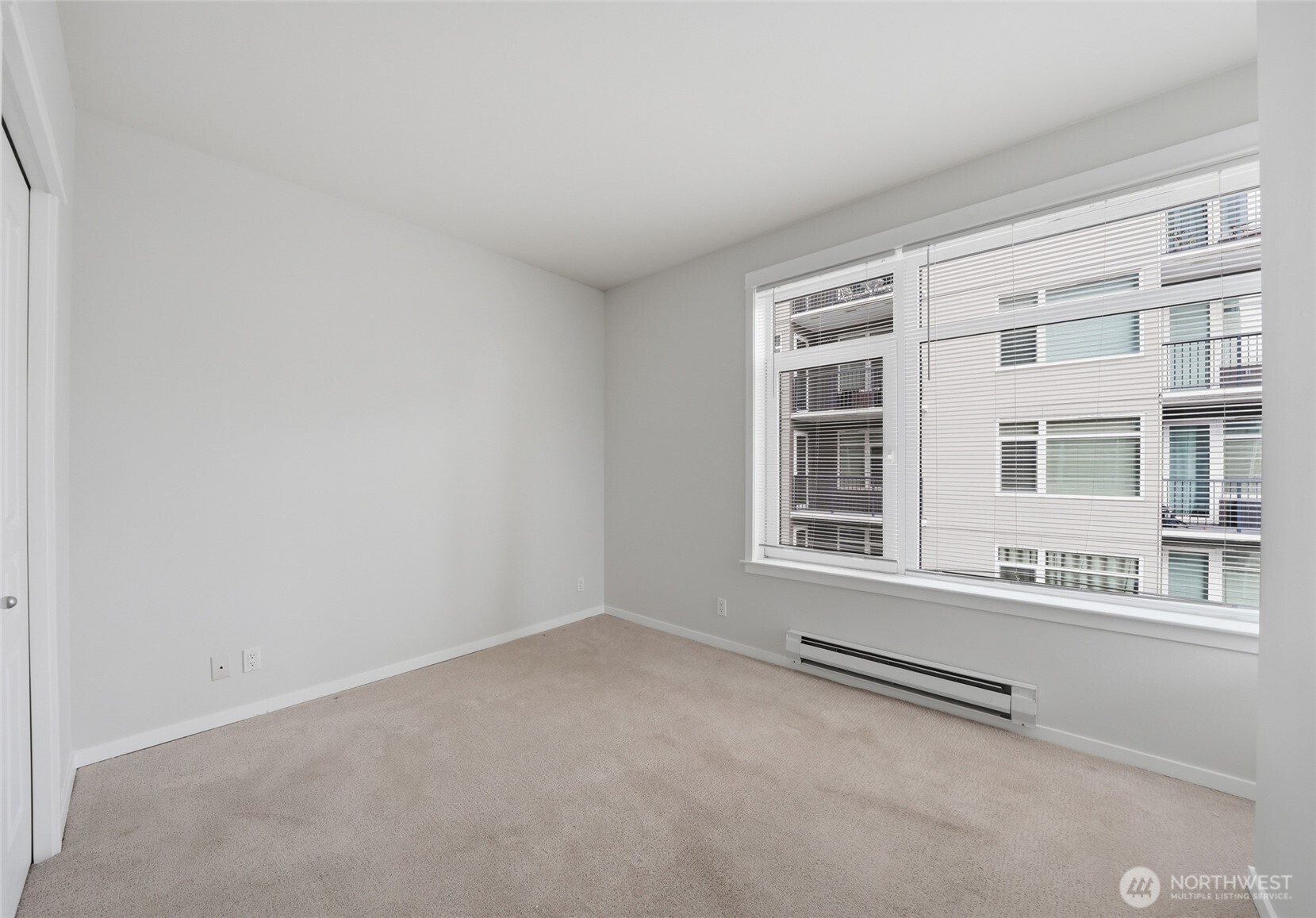 2801 1st Avenue, Unit 504 Seattle, WA 98121 - Photo 13 of 34 a view of an empty room with a window