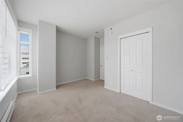a view of an empty room with a window