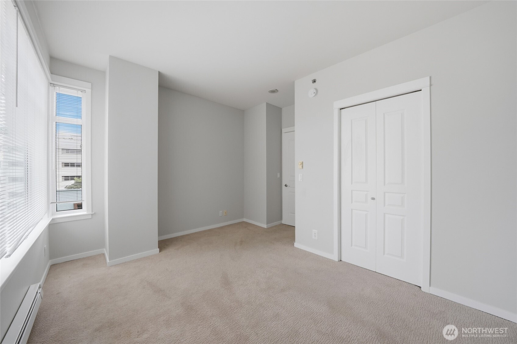 2801 1st Avenue, Unit 504 Seattle, WA 98121 - Photo 14 of 34 a view of an empty room with a window