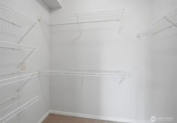a view of a room with racks on the wall