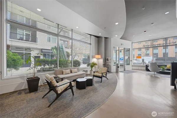 a living room with furniture and a large window