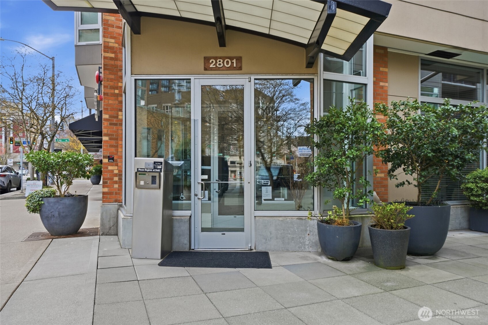 2801 1st Avenue, Unit 504 Seattle, WA 98121 - Photo 2 of 34 a view of a street with potted plants
