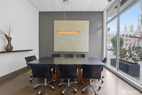 a view of a dining room with furniture and a window