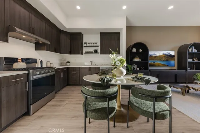 a kitchen with a table and chairs in it
