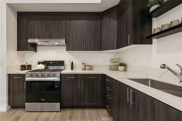 a kitchen with a stove and a sink