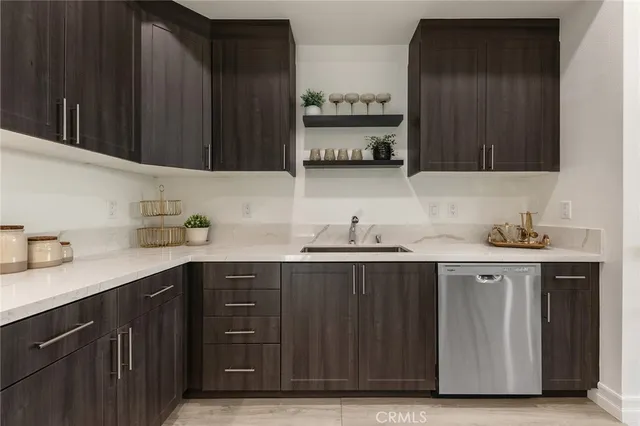 a kitchen with a sink and cabinets
