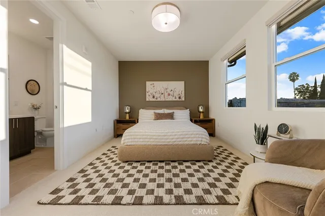 a bedroom with a large bed and a window