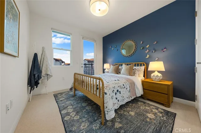 a bedroom with a bed and window