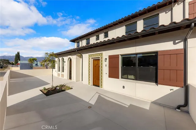 a large building with a large window and parking space