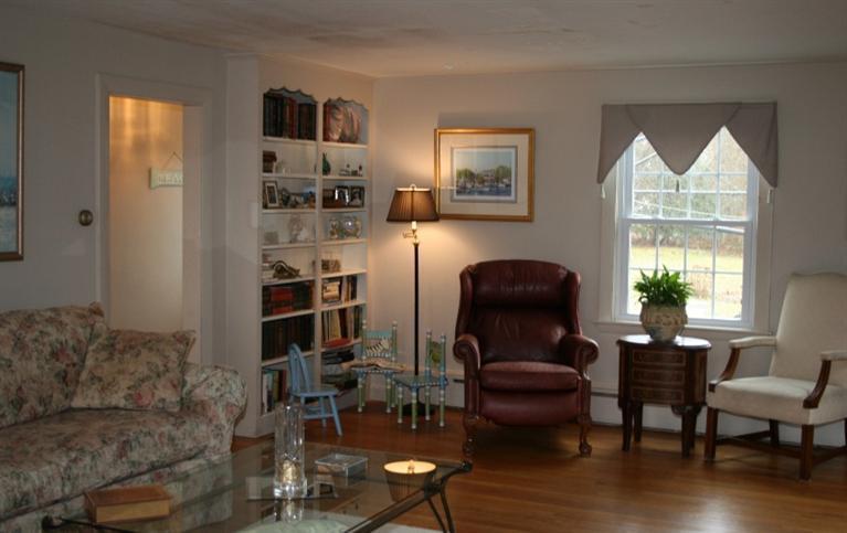 411 Lower County Road Harwich Port, MA 02646 - Photo 11 of 32 a living room with furniture and a window