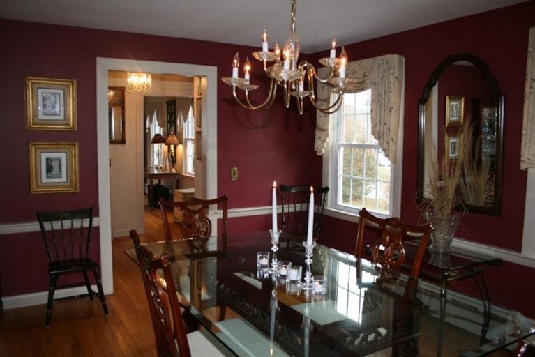 411 Lower County Road Harwich Port, MA 02646 - Photo 13 of 32 a view of a dining room with furniture and chandelier