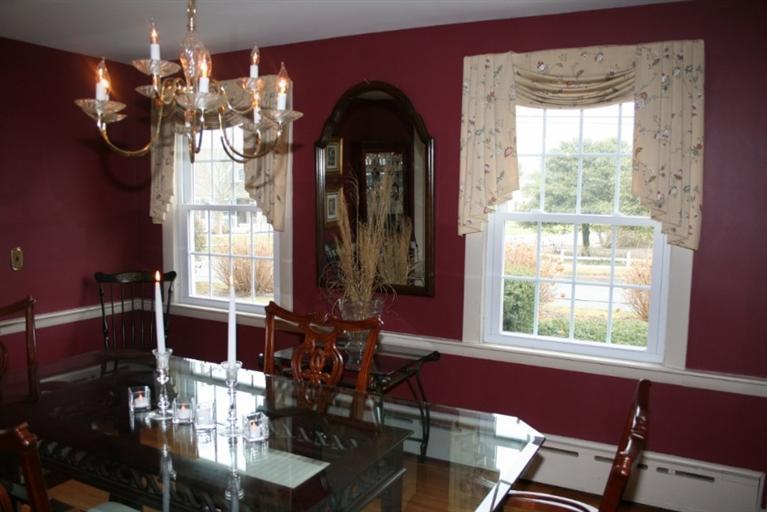 411 Lower County Road Harwich Port, MA 02646 - Photo 14 of 32 a view of a dining room with furniture and chandelier
