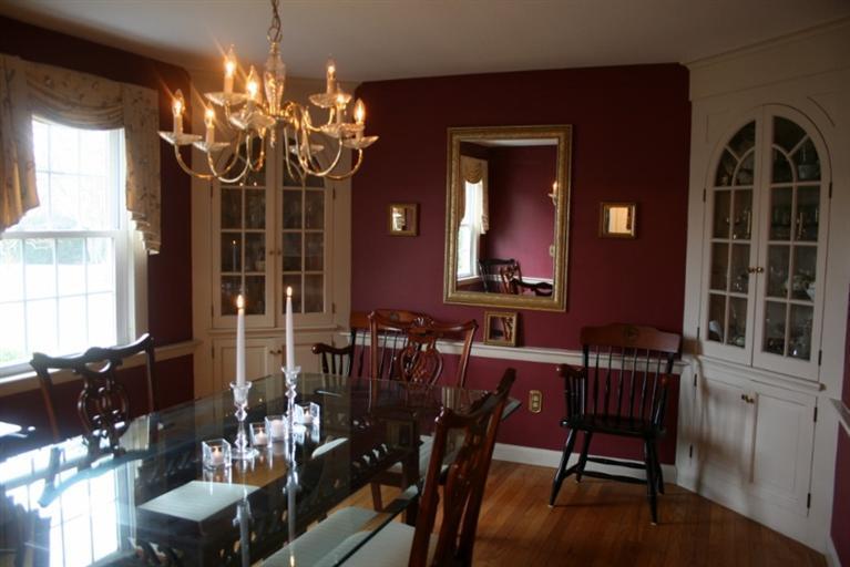 411 Lower County Road Harwich Port, MA 02646 - Photo 15 of 32 a view of a dining room with furniture and chandelier