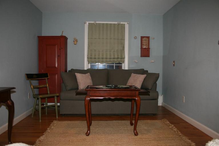 411 Lower County Road Harwich Port, MA 02646 - Photo 16 of 32 a view of a workspace with furniture and a window