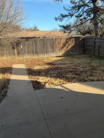 a view of a backyard of the house