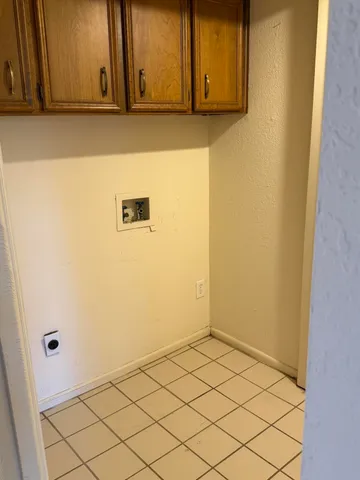 a view of a utility room with wooden floor