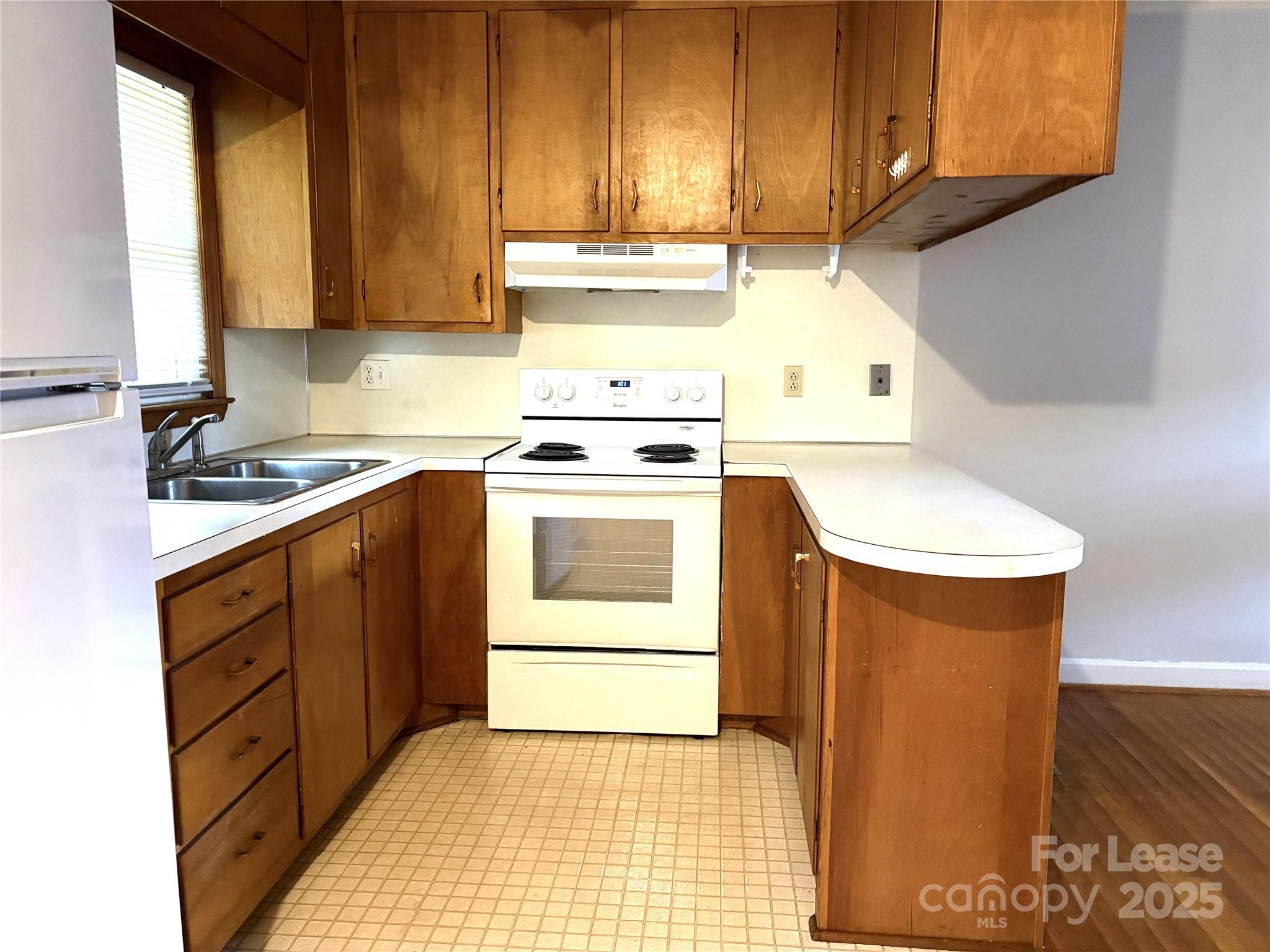 107 Ferstl Avenue Belmont, NC 28012 - Photo 9 of 15 a kitchen with a sink stove and cabinets
