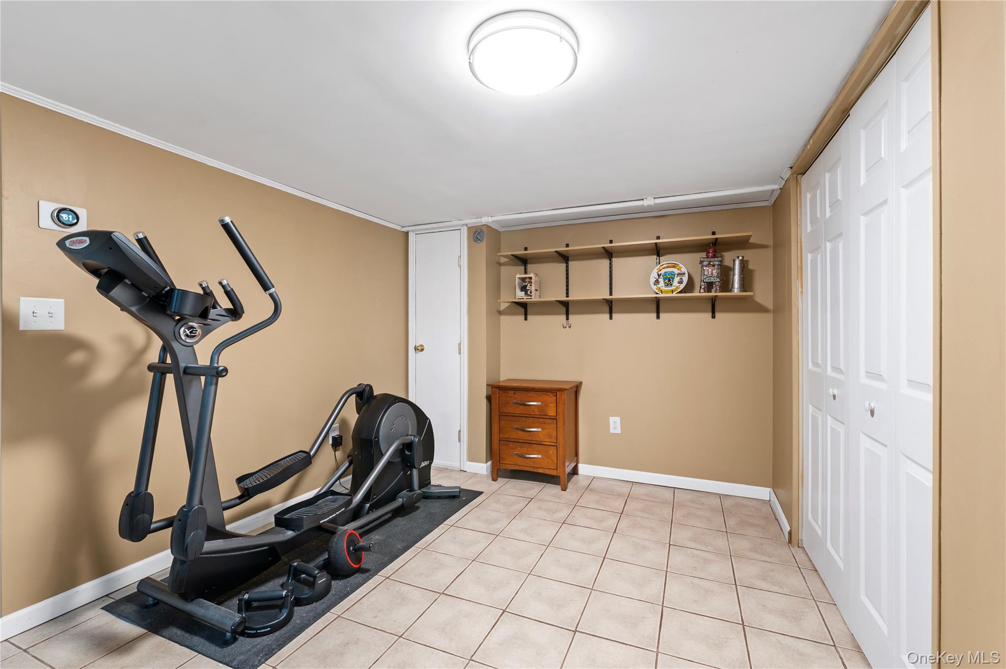3 Cheshire Road Bethpage, NY 11714 - Photo 20 of 26 a view of a room with gym equipment