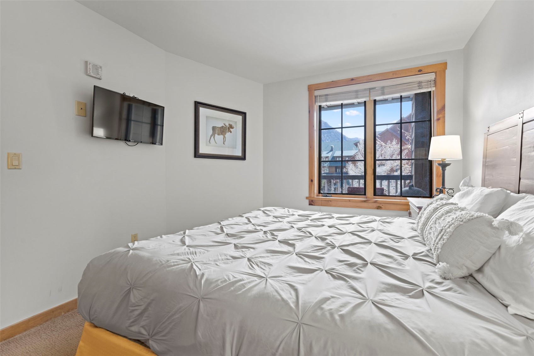 150 Dercum Square, Unit 8502 Keystone, CO 80435 - Photo 22 of 47 a bedroom with a bed and a flat screen tv
