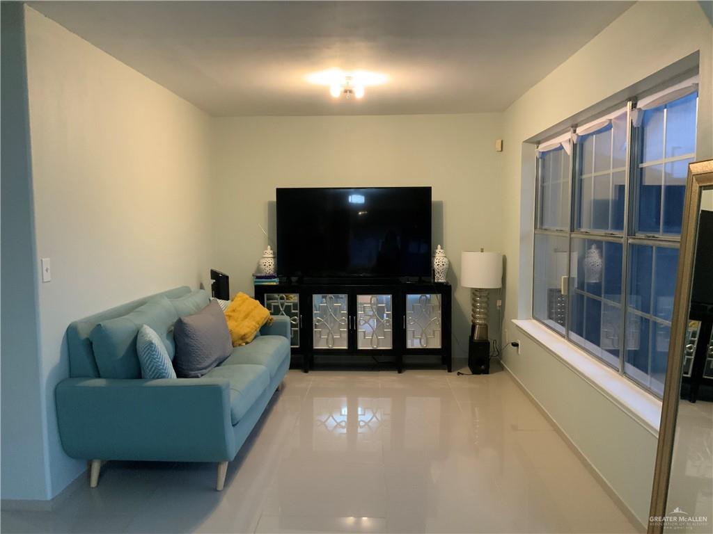 903 North 35 Street Hidalgo, TX 78557 - Photo 7 of 11 a living room with furniture and a flat screen tv