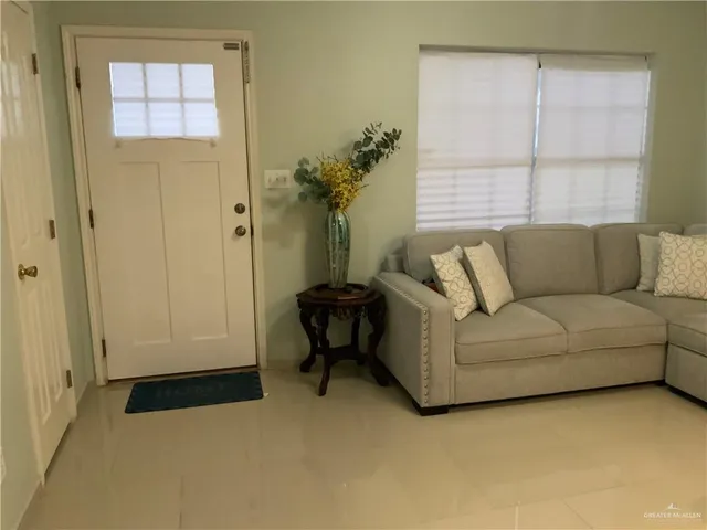 a living room with furniture and a window