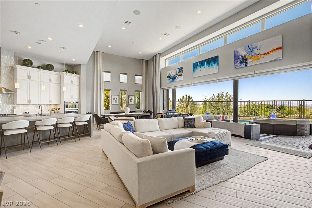 6014 Willow Ridge Court Las Vegas, NV 89135 - Photo 28 of 99 An open concept living area connects seamlessly to the outdoors, offering an expansive feel.