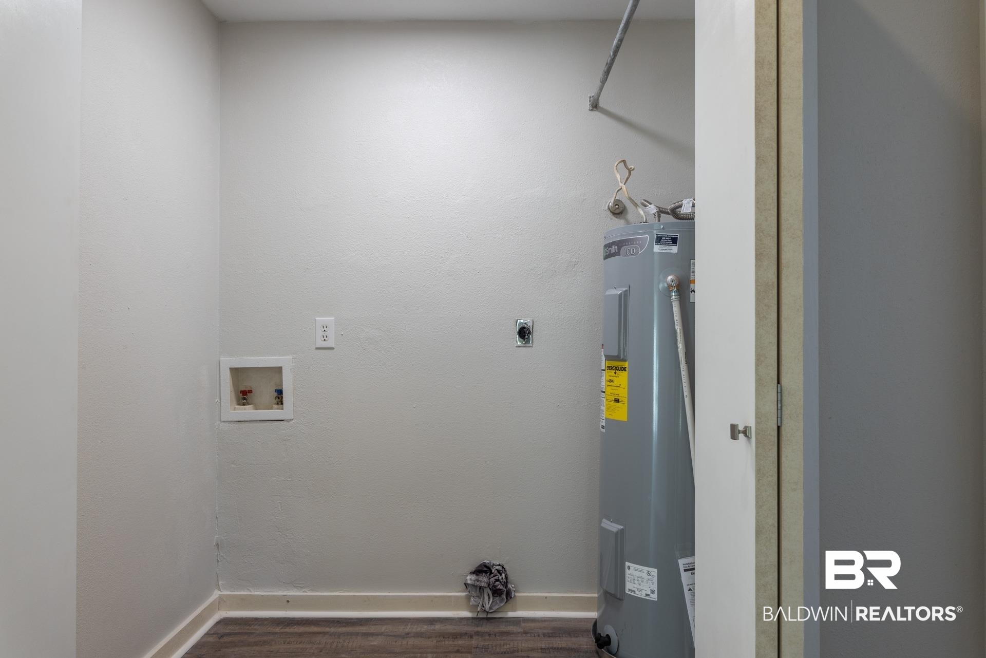413 West Fort Morgan Road Gulf Shores, AL 36542 - Photo 23 of 29 Laundry area with baseboards, hookup for an electric dryer, dark wood-style flooring, washer hookup, and electric water heater