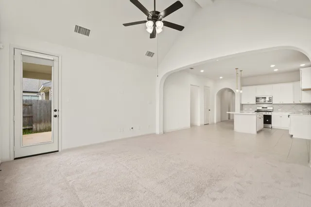 a view of a kitchen with a sink and a window