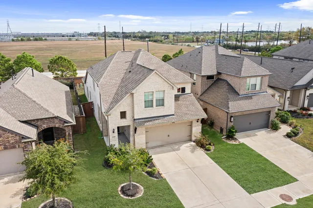 an aerial view of residential houses with outdoor space