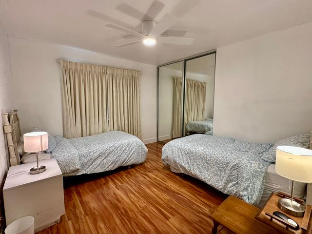 a bedroom with bed and window