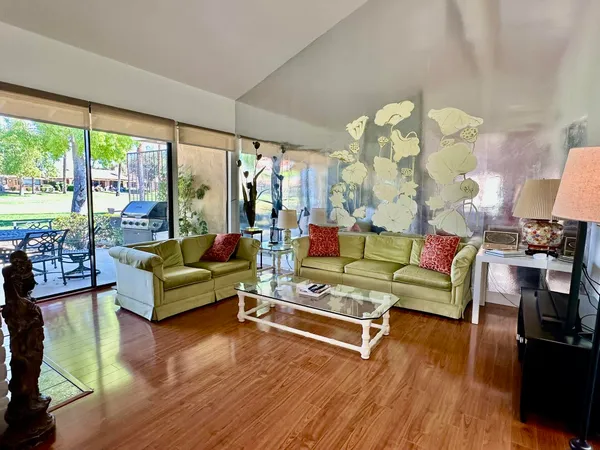 a living room with furniture and a large window