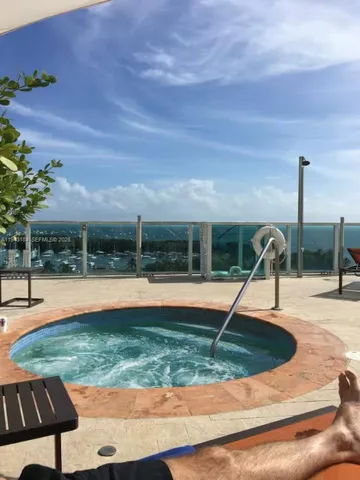 a view of a swimming pool with a lounge chair
