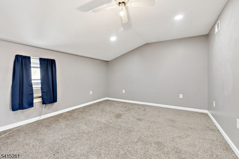 32 Glenville Road Edison, NJ 08817 - Photo 15 of 25 an empty room with windows and cabinet