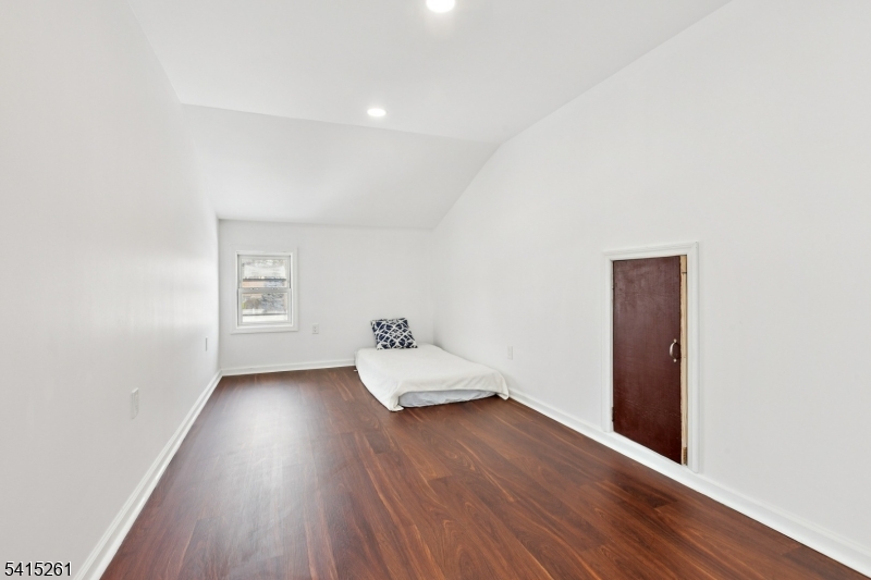 32 Glenville Road Edison, NJ 08817 - Photo 17 of 25 an empty room with wooden floor and windows