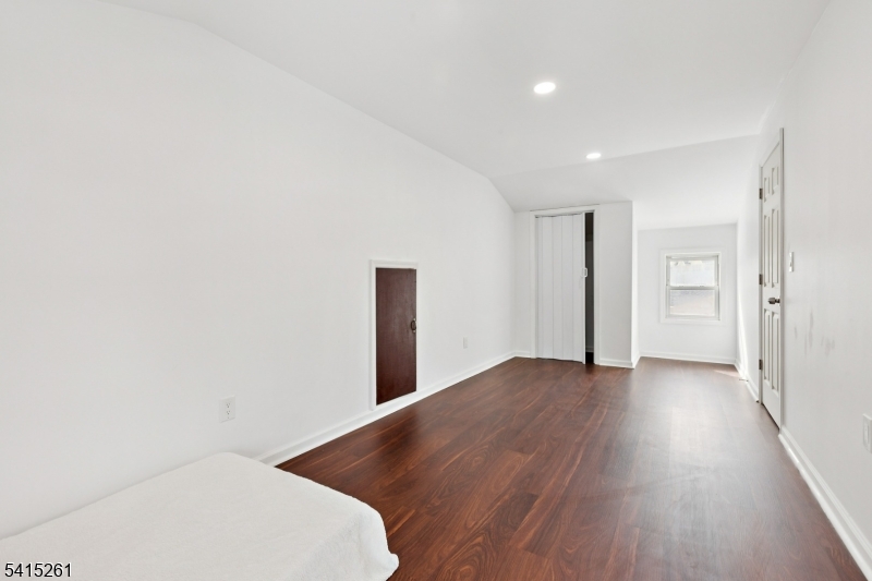 32 Glenville Road Edison, NJ 08817 - Photo 19 of 25 a view of an empty room with wooden floor