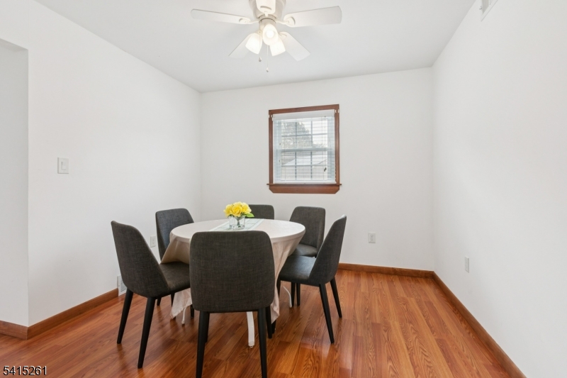 32 Glenville Road Edison, NJ 08817 - Photo 6 of 25 a view of a dining room with furniture and wooden floor