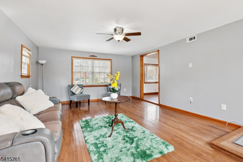 32 Glenville Road Edison, NJ 08817 - Photo 10 of 25 a living room with furniture and a wooden floor