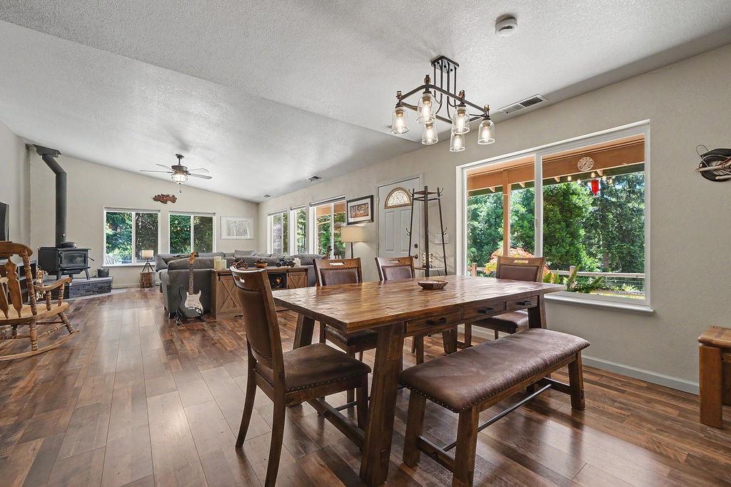 26845 Spring Court Pioneer, CA 95666 - Photo 12 of 89 a view of a dining room with furniture window and wooden floor
