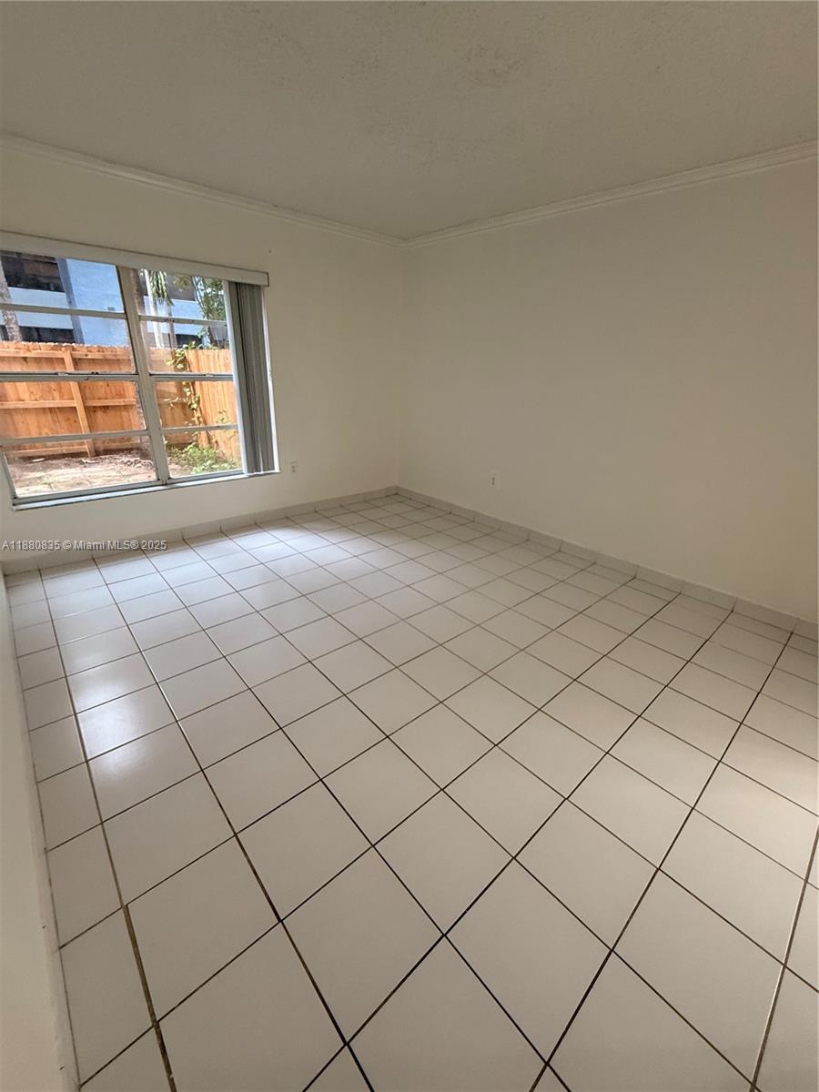 6300 Southwest 138th Court, Unit 102 Miami, FL 33183 - Photo 13 of 17 a view of an empty room and window