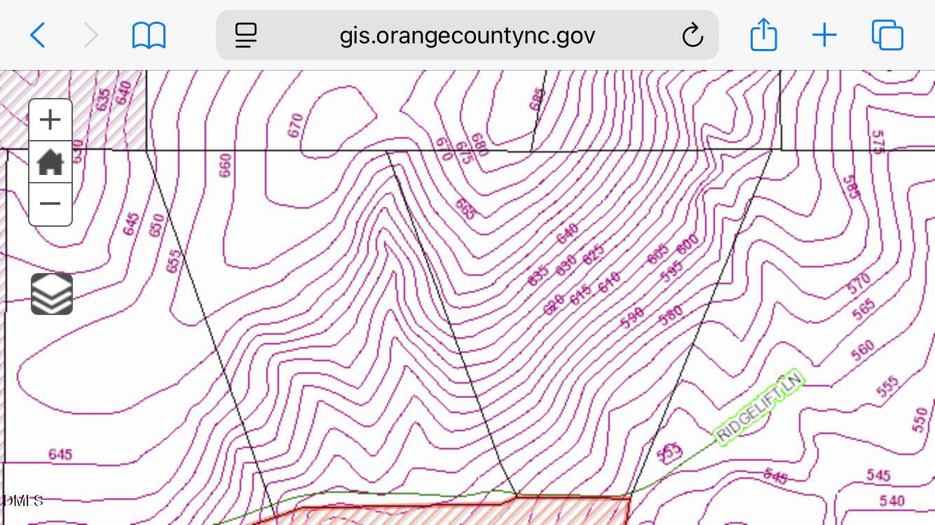 1122 Ridgelift Lane Hillsborough, NC 27278 - Photo 7 of 26 a picture of a wall with a white wall and a white comforter