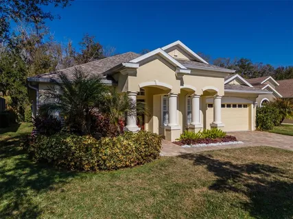 a living room with stainless steel appliances kitchen island granite countertop furniture and a large window