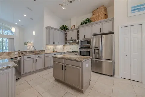 a view of a dining room with furniture and window