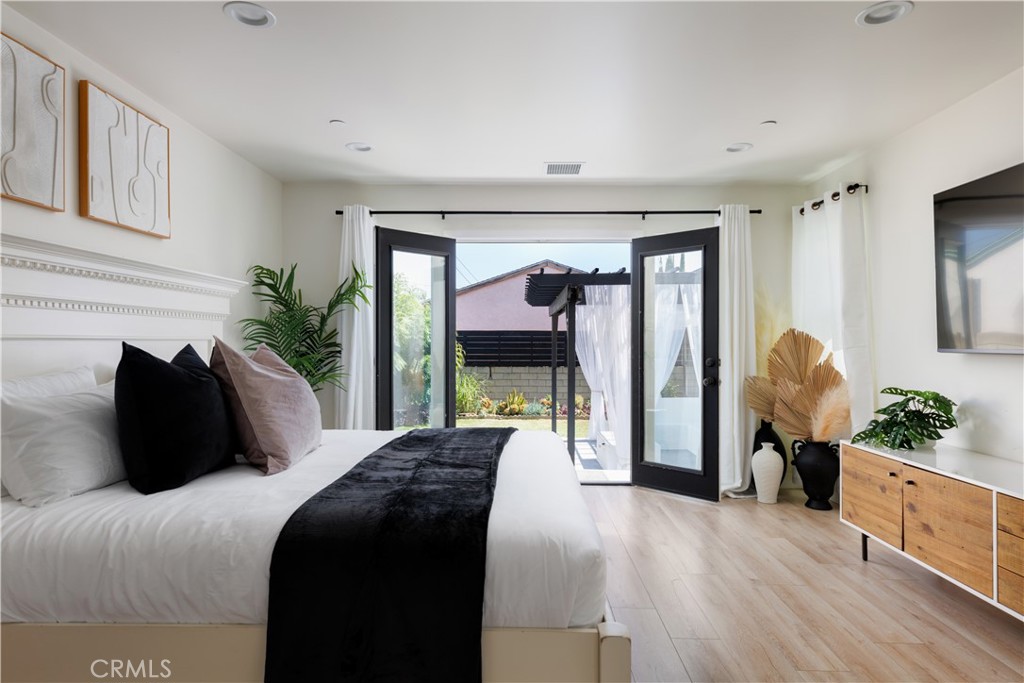 2820 Front Street Alhambra, CA 91803 - Photo 12 of 19 a bedroom with a large bed and a large window